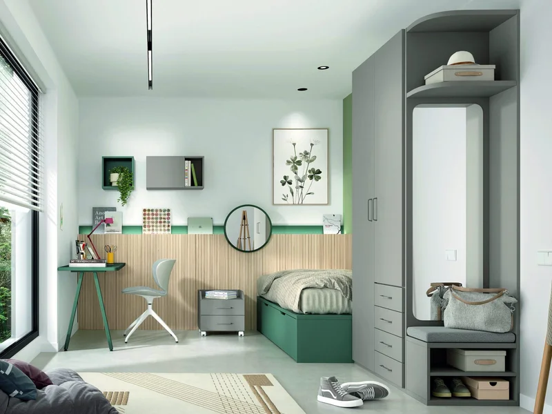Habitación juvenil en verde y madera, con cama, escritorio, armario y zona de espejo.